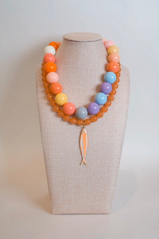 Orange Creamsicle Fish Pendant Necklace styled on neck - House of Me boutique Norman OK