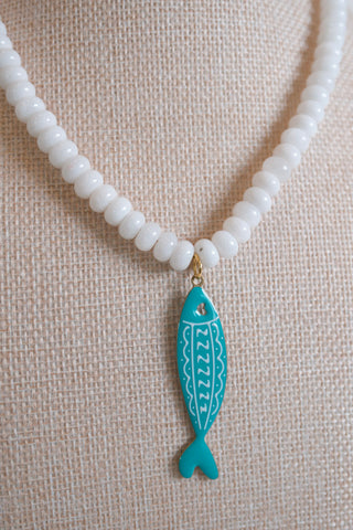 White Beaded Fish Pendant Necklace styled on neck - House of Me boutique Norman OK