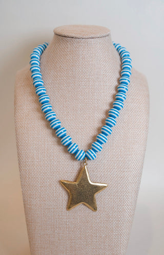 Blue Striped Star Pendant Necklace styled on neck - House of Me boutique Norman OK