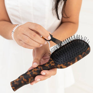 Tortoise detangler hair brush by Teleties in use - House of Me boutique Norman OK