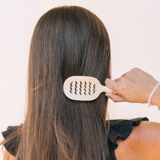 Tan mini vented hair brush by Teleties lifestyle view - House of Me boutique Norman OK