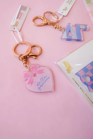 Sorority sweetheart bow acrylic keychain by The Darling Effect styled view - House of Me boutique Norman OK