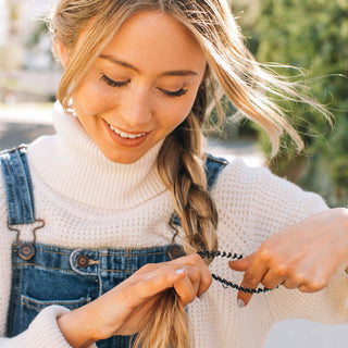 Jet Black small spiral hair ties by Teleties close up view - House of Me boutique Norman OK