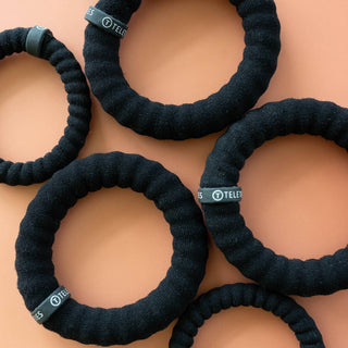 Jet Black small nylon hair ties by Teleties on wrist - House of Me boutique Norman OK